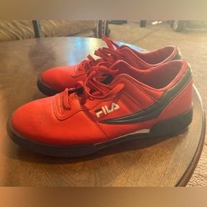 Men’s red low top Fila’s size 13